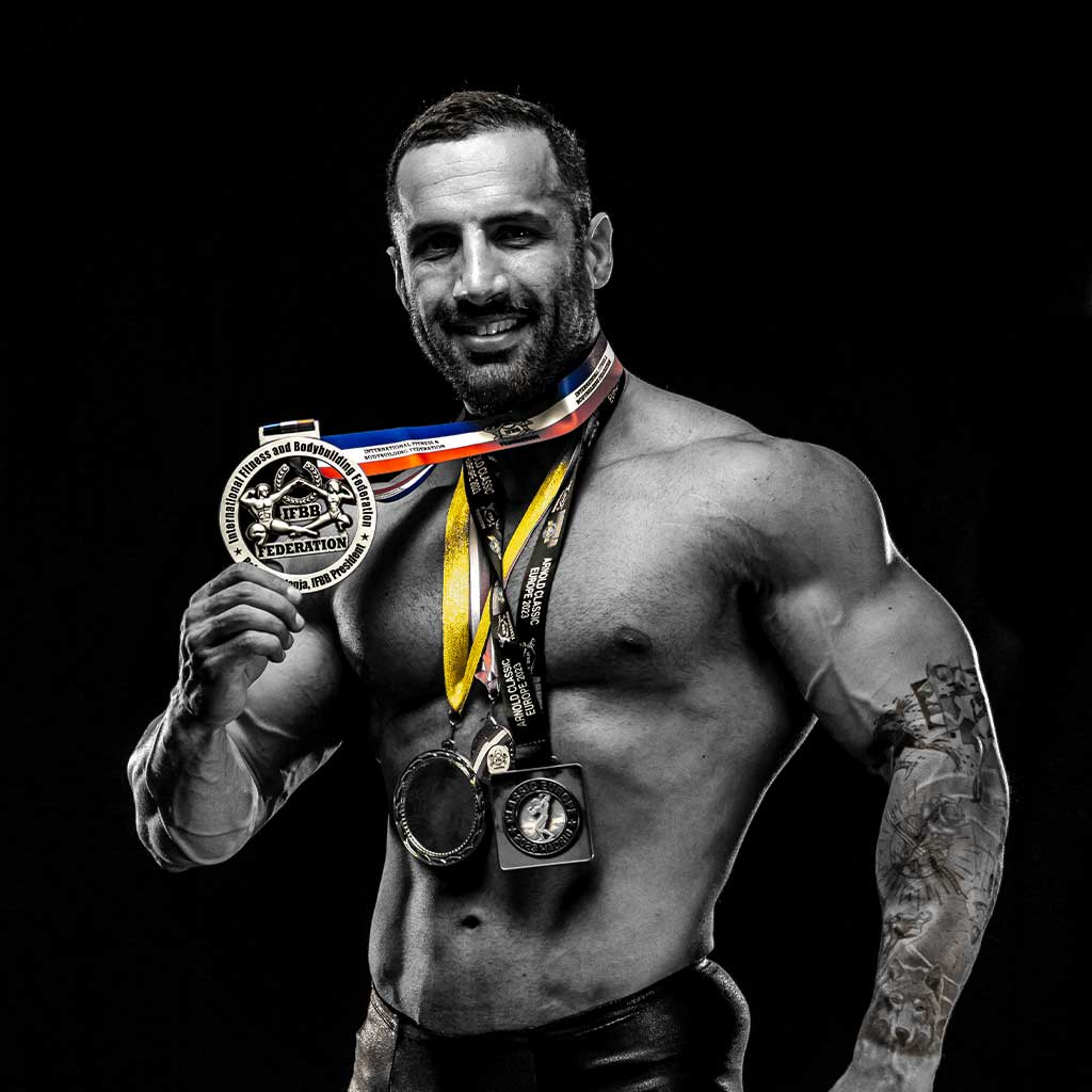 Najeeb posing with his medals